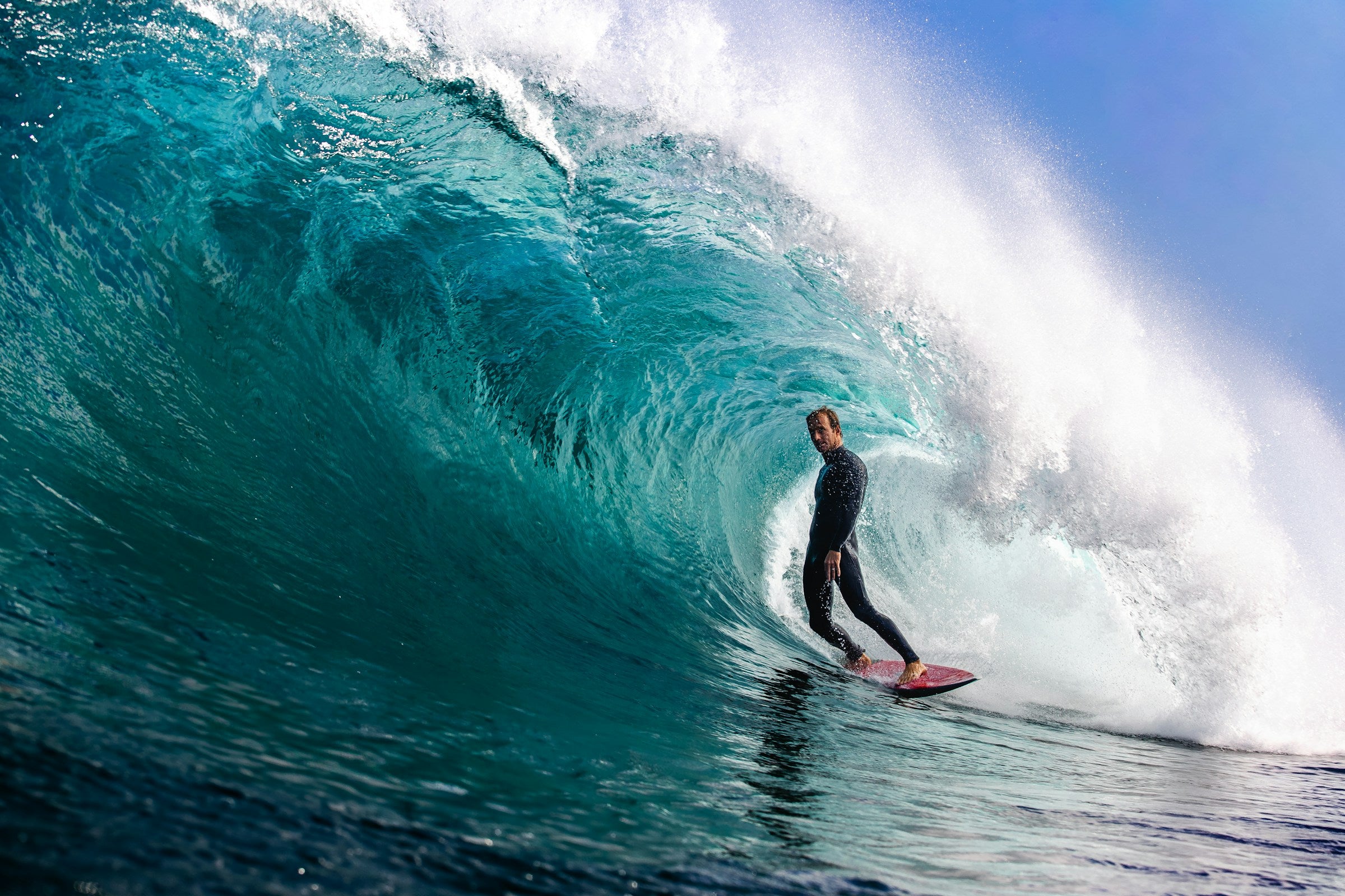 Surfer inside a wave barrel